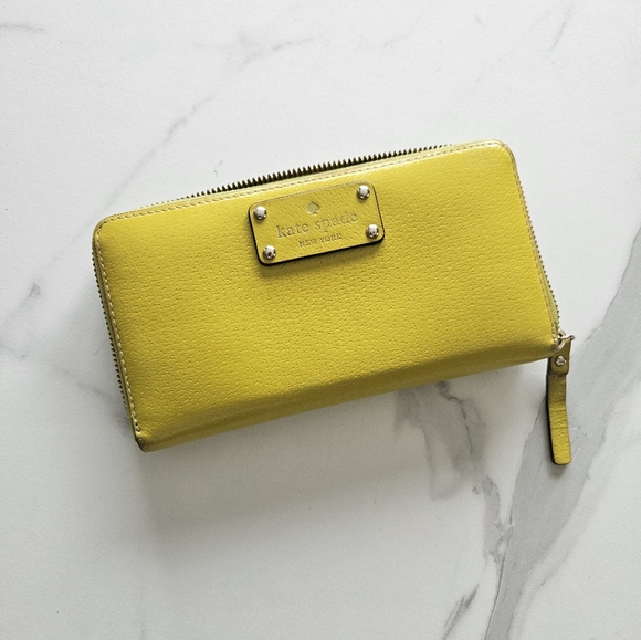 kate spade Handbags - Kate Spade Yellow Zip-Around Wallet